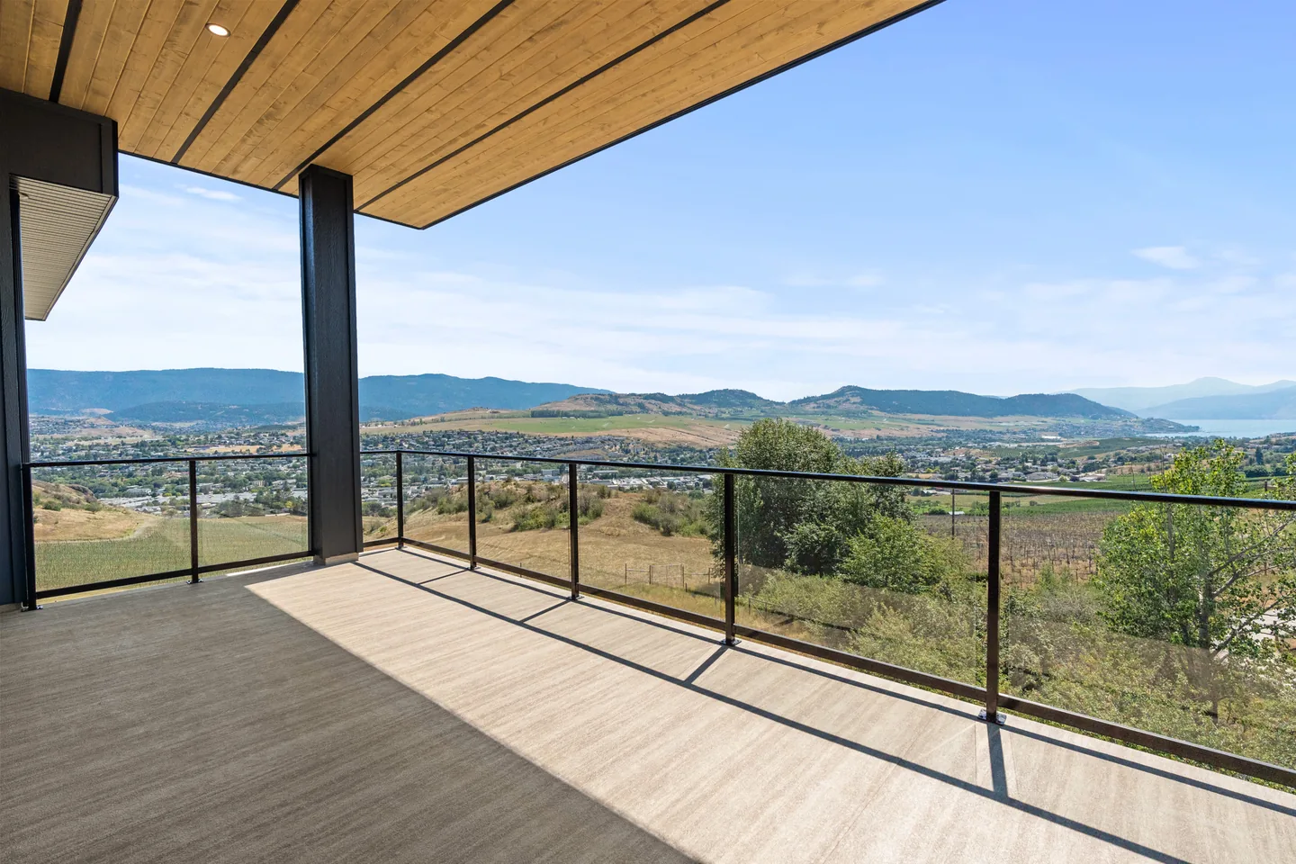 Covered deck overlooking the valley and Okanagan Lake